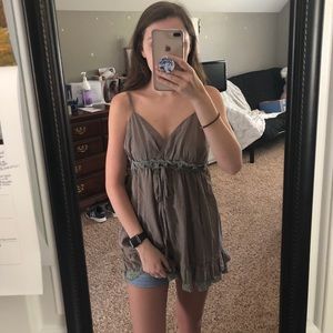 Spaghetti strap top with lace trim and tie